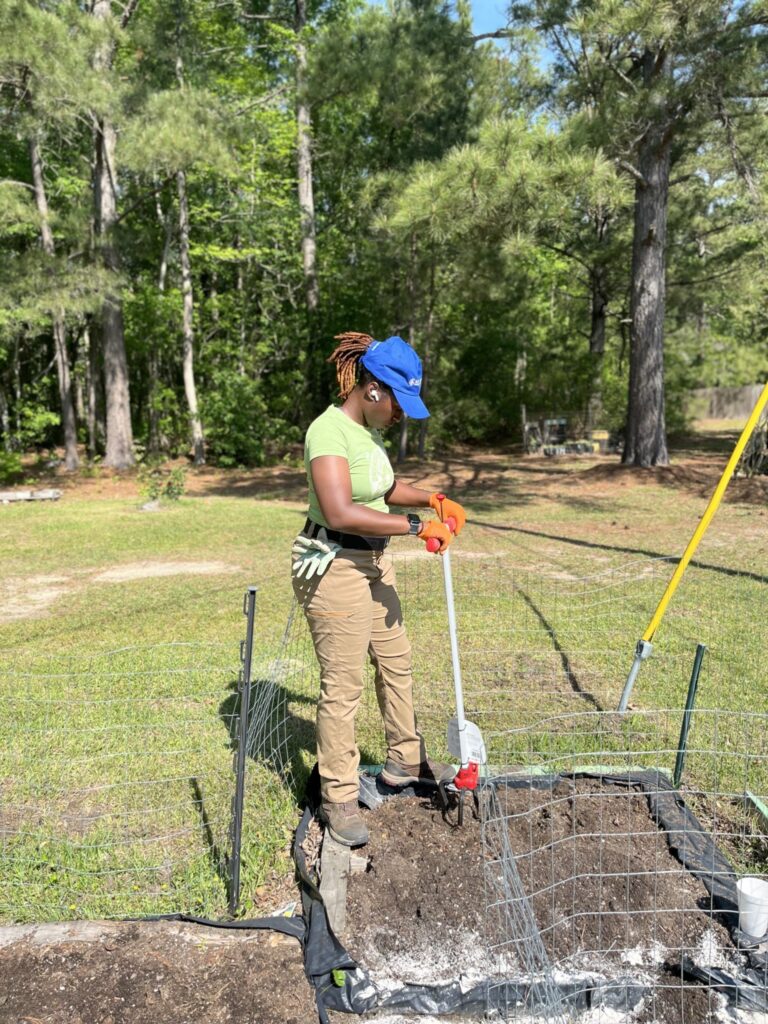 Woman using a tool on the farm