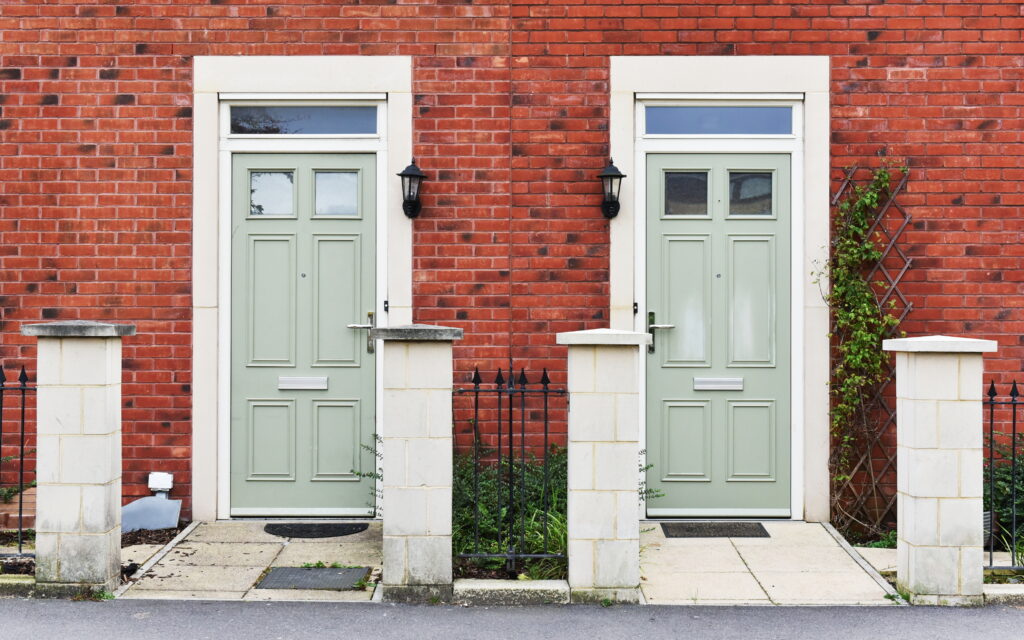 Picture of two sets of doors painted in the same shade of mint green