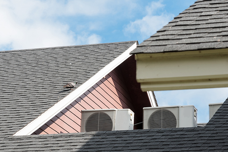 Picture of a roof with air con units along the edge