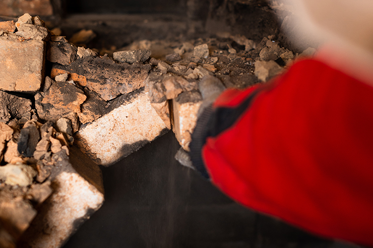 Picture of a tradesperson removing a chimney breast