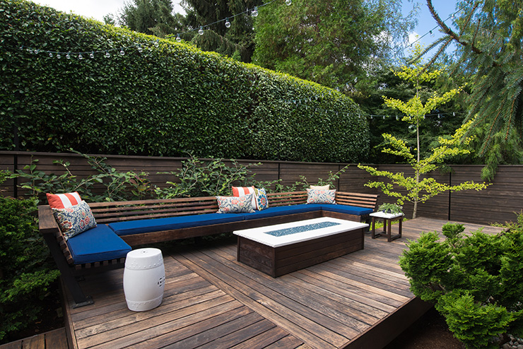 Picture of a wooden garden deck with a low table and seating area