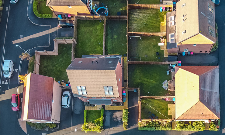 Picture of a birds eye view of homes with wooden fences separating them