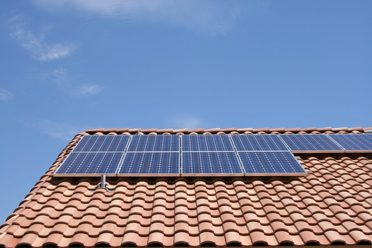 Solar panels on a tile roof.