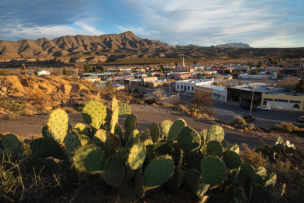 The setting sun lights up the cactuses and the Caballo Mountains surrounding Truth or Consequences, New Mexico.