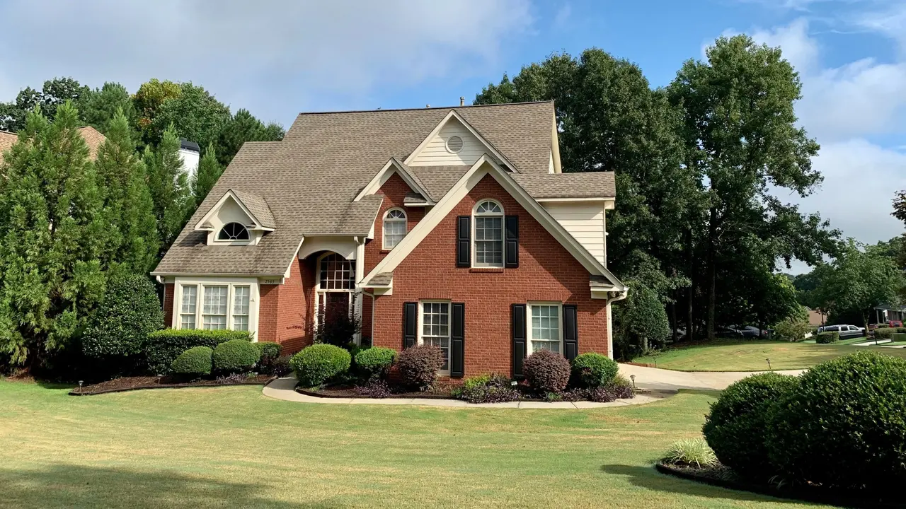 Brick house with lush, green lawn